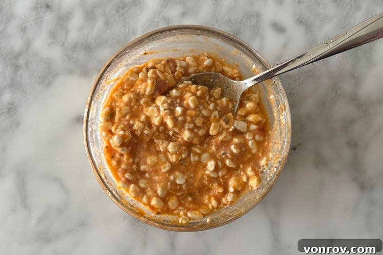 Mixed cottage cheese with sauce in a bowl